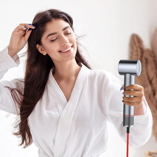 a beautiful girl blow hair with high speed hair dryer