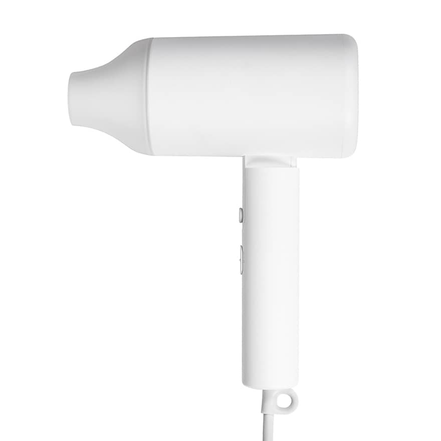 Modern white hair dryer with nozzle isolated on white. Hair dryer side view isolated on white background.